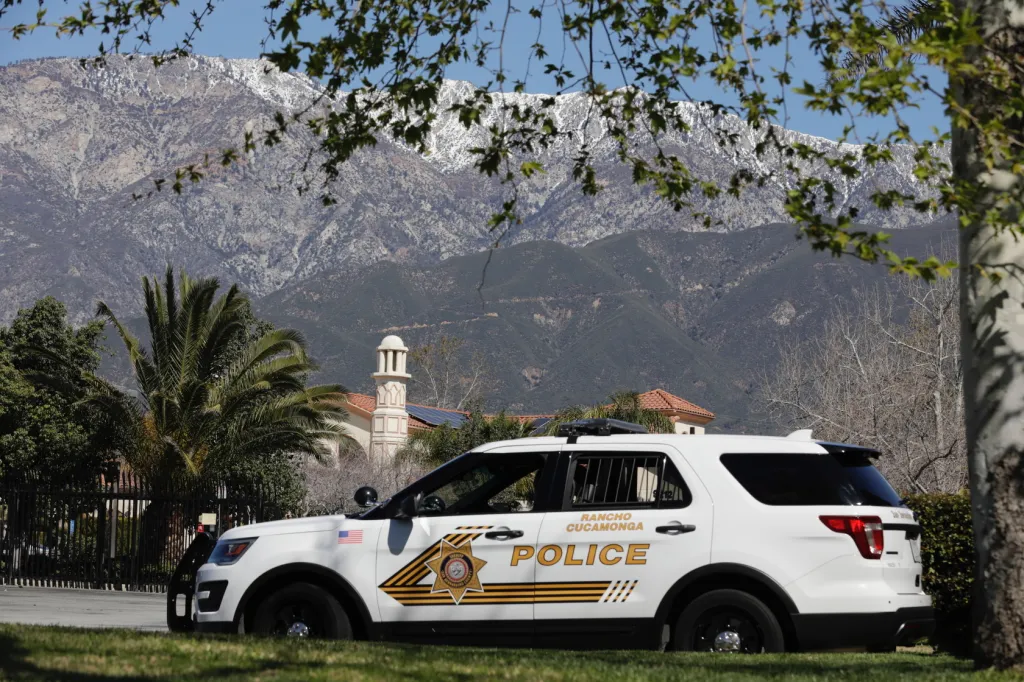A Rancho Cucamonga police cruiser parked outside the Islamic Center of Inland Empire with mountains in the background, providing security after the Christchurch mosque shootings.