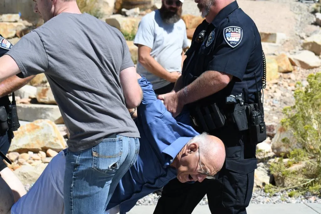 George Zinn is hauled away by police after claiming he shot Charlie Kirk at Utah Valley University on Sept. 10, 2026.
