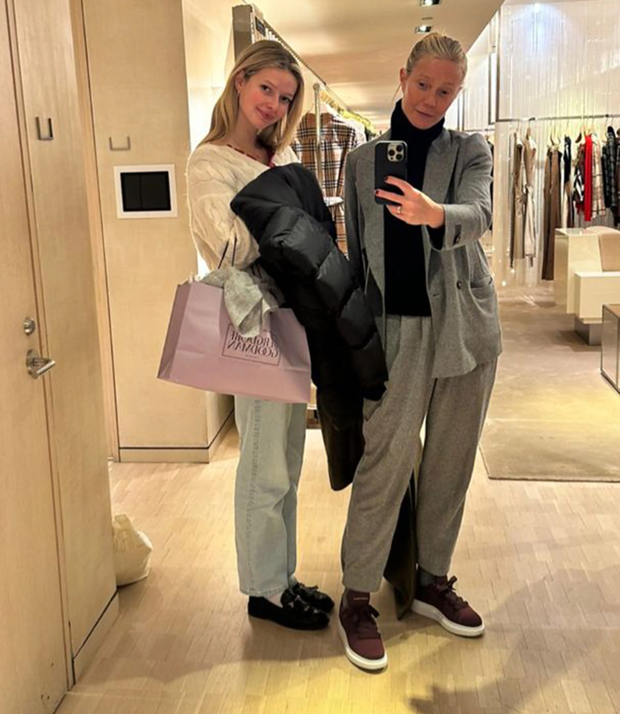 Gwyneth Paltrow takes a selfie with her daughter, Apple, in a retail store.