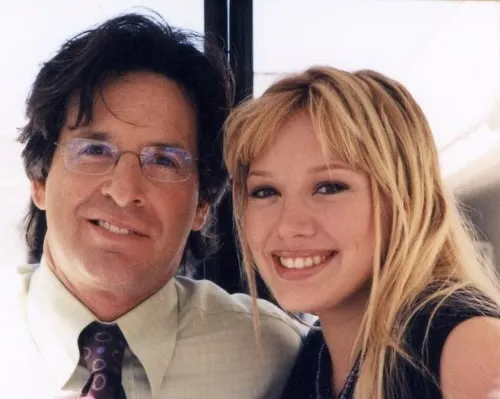 Robert Carradine and Hilary Duff smiling.