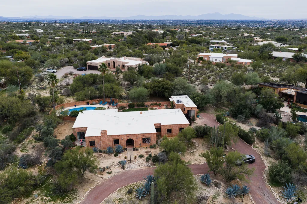 Aerial view of the Tucson home of Nancy Guthrie, mother of Savannah Guthrie, in a desert landscape.