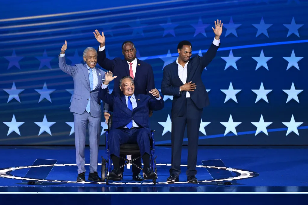 Jesse Jackson being honored onstage with three other men at the Democratic National Convention.