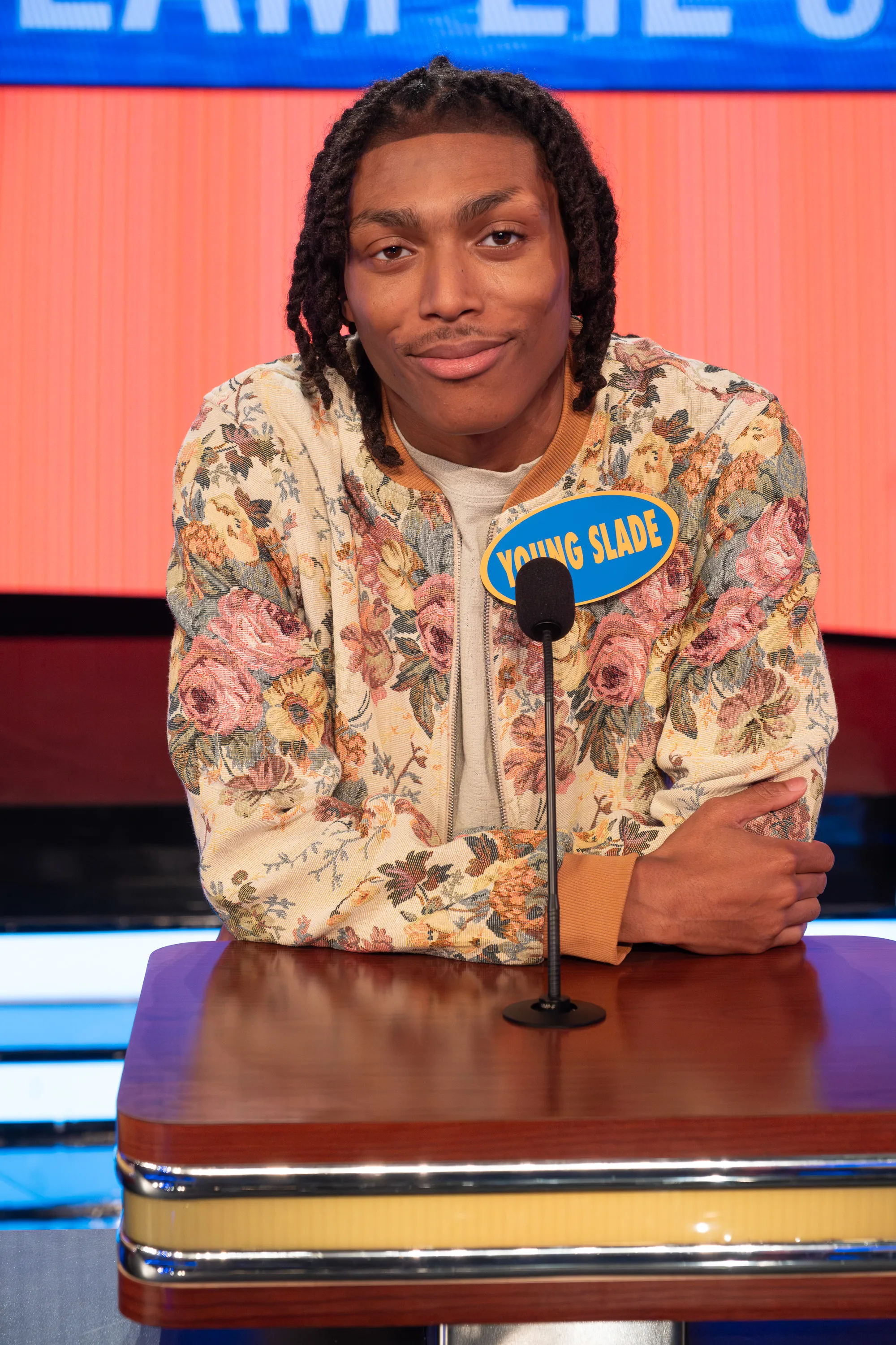 Young Slade appearing on Celebrity Family Feud, smiling at the camera.