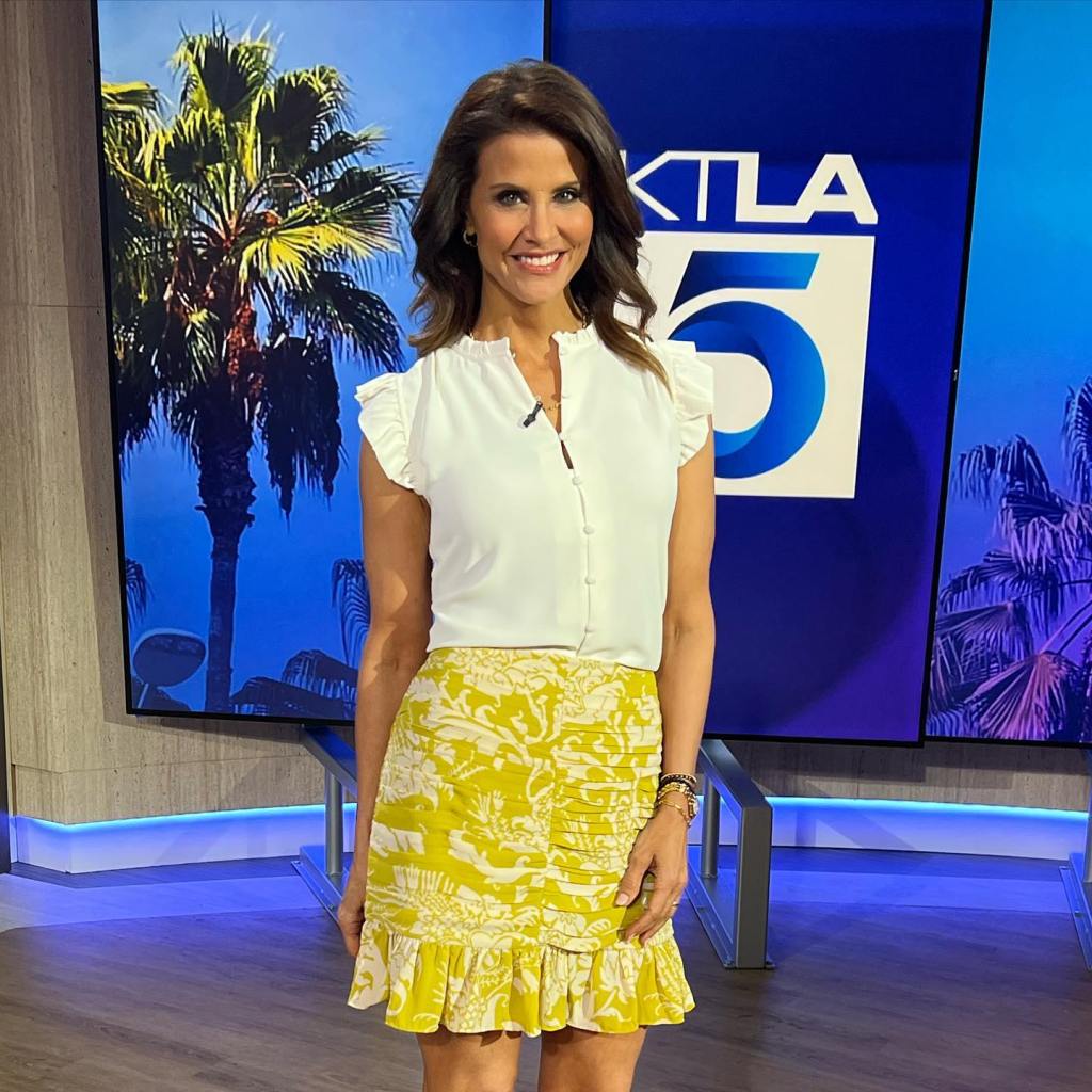 Former KTLA anchor Lu Parker smiling in front of a news desk with palm tree graphics.