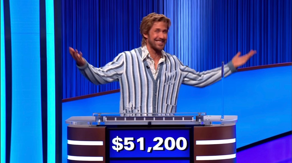 Ryan Gosling with his arms spread out at a Jeopardy! podium with 