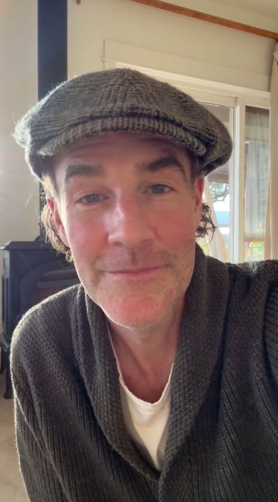 James Van Der Beek wearing a gray flat cap and dark gray cardigan.