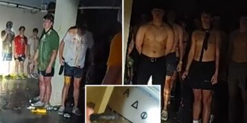 Disturbing viral bodycam footage captures dozens of shirtless, blindfolded University of Iowa pledges covered in food in frat basement