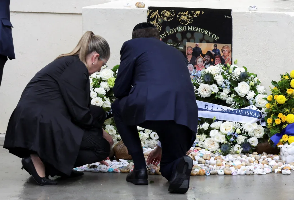 Herzog and first lady Michal Herzog lay a wreath during a ceremony to honor the families and victims of a deadly mass shooting during a Jewish Hanukkah celebration
