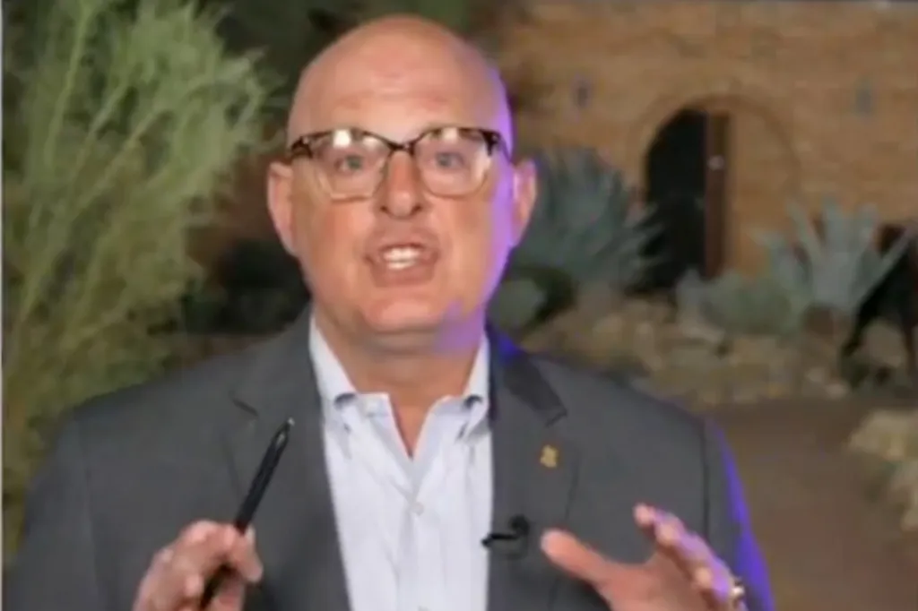 James Gagliano, an ex-FBI agent, speaking while holding a pen.