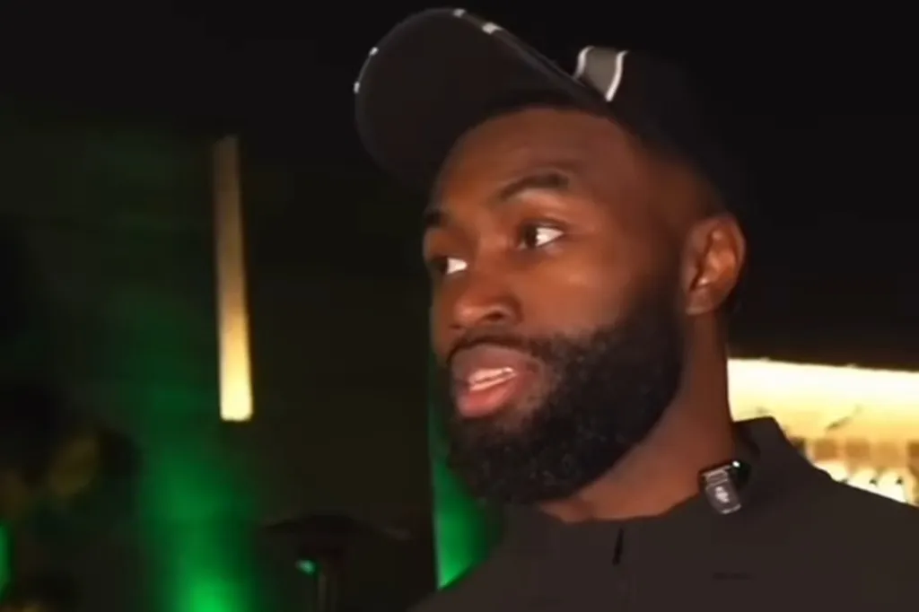 Jaylen Brown, wearing a black cap, looking off to the right.