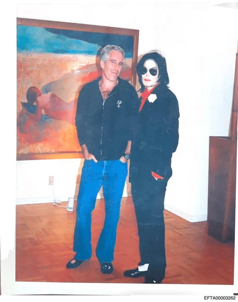 Jeffrey Epstein and Michael Jackson posing for a photo.