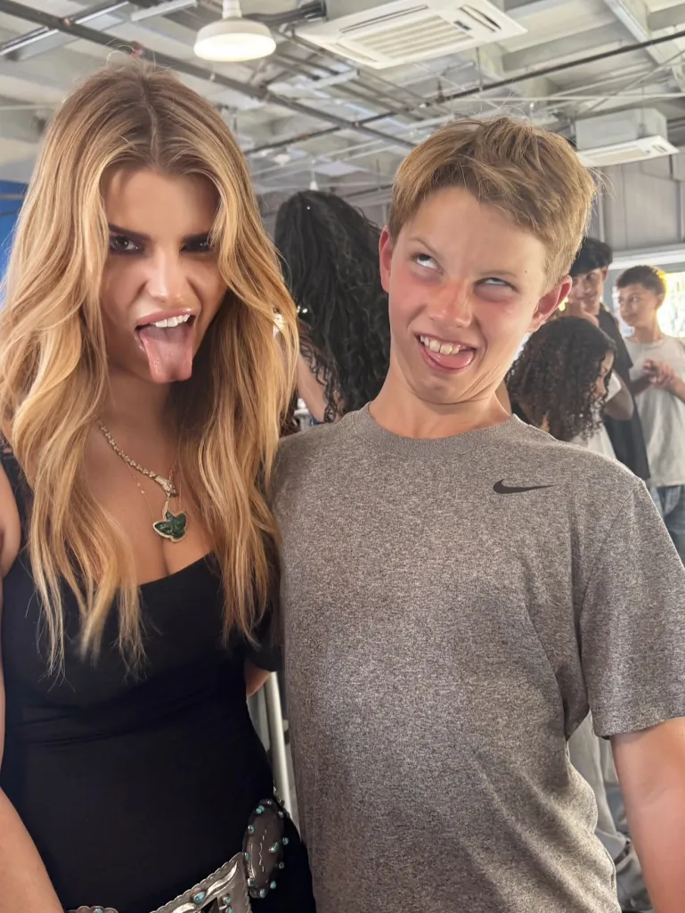 Jessica Simpson and her son Ace sticking out their tongues and making funny faces.
