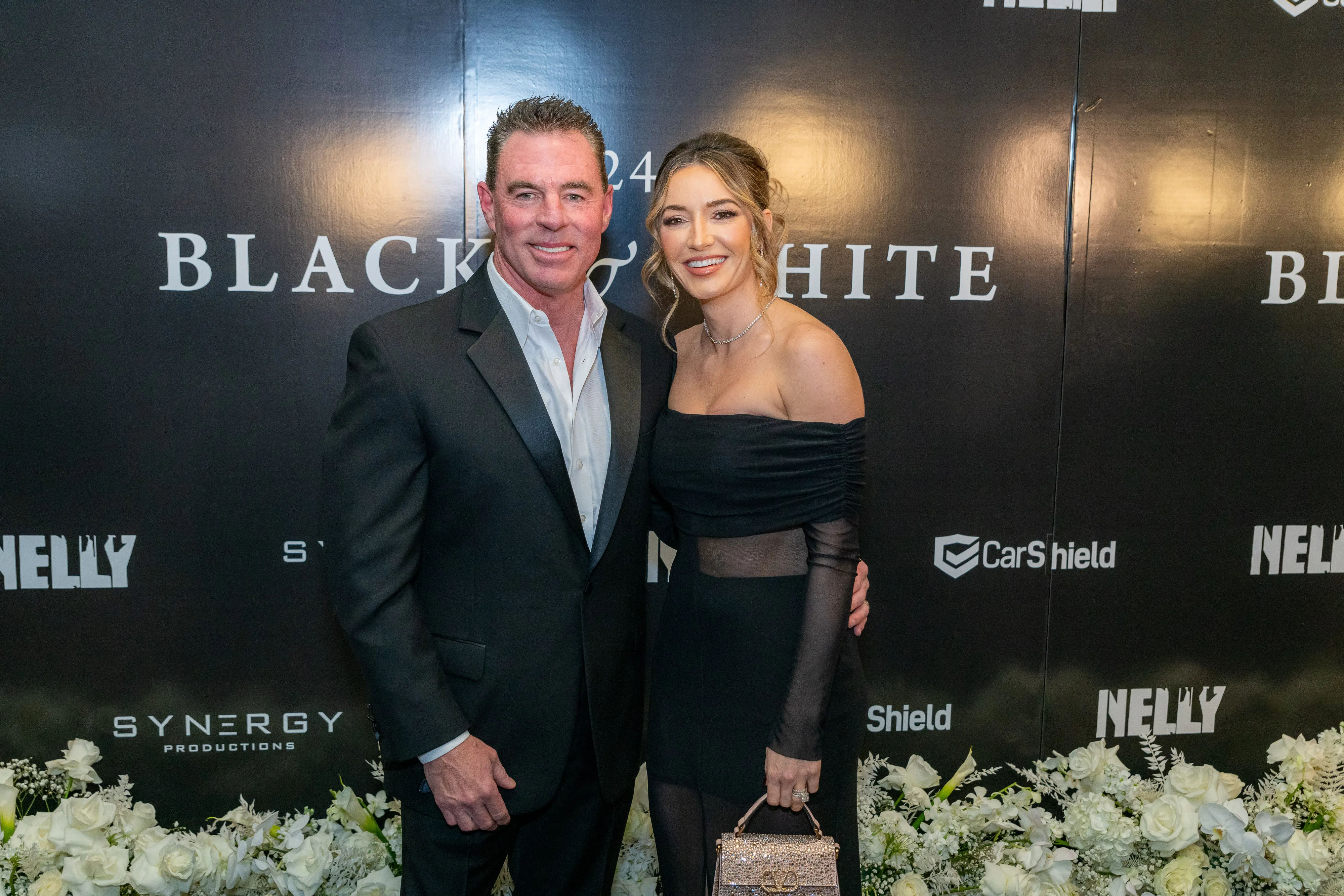 Jim Edmonds and Kortnie O'Connor smiling on the red carpet.