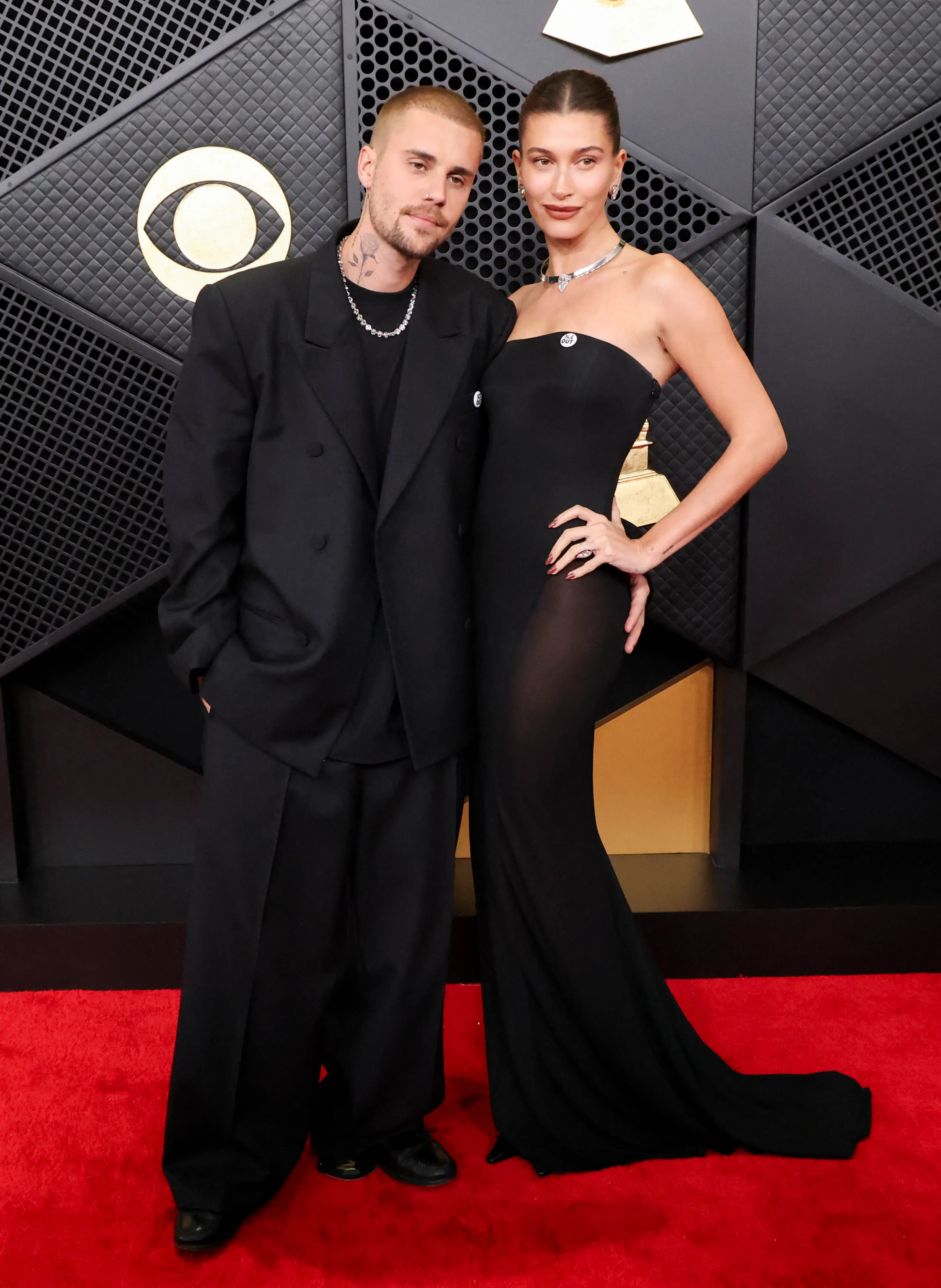 Justin and Hailey Bieber pose on the red carpet at the 68th Annual Grammy Awards.