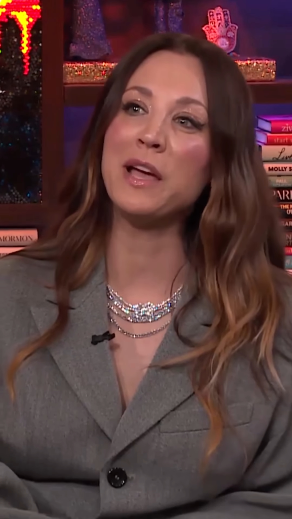 Kaley Cuoco in a gray blazer and diamond necklace.