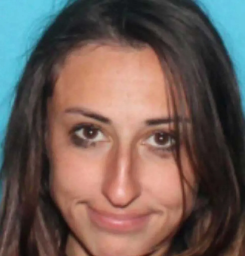 Headshot of Kehlani Rogers smiling faintly.