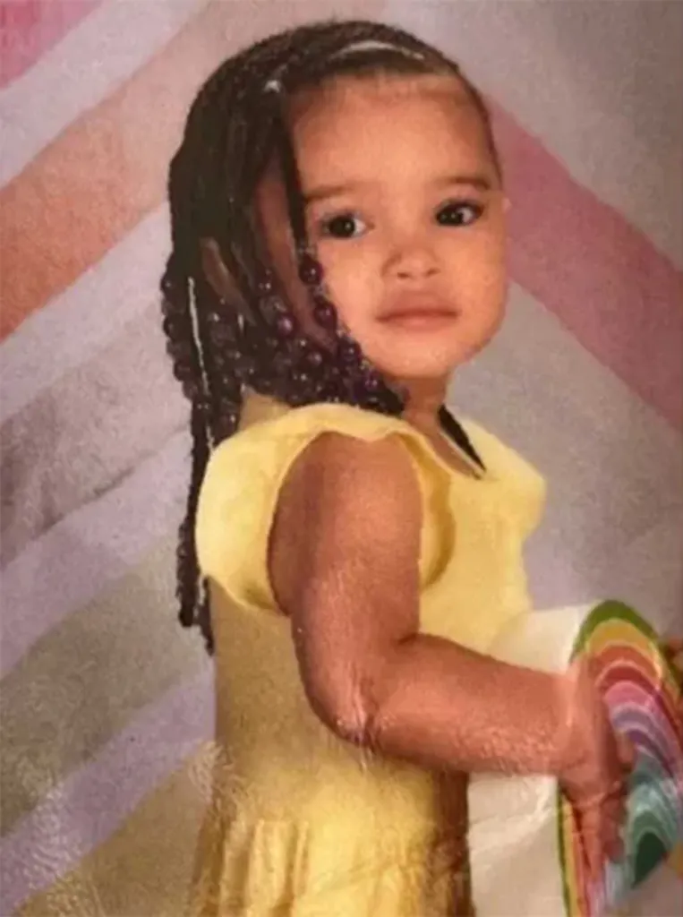 Kehlani Rogers in a yellow dress with braided hair and purple beads.