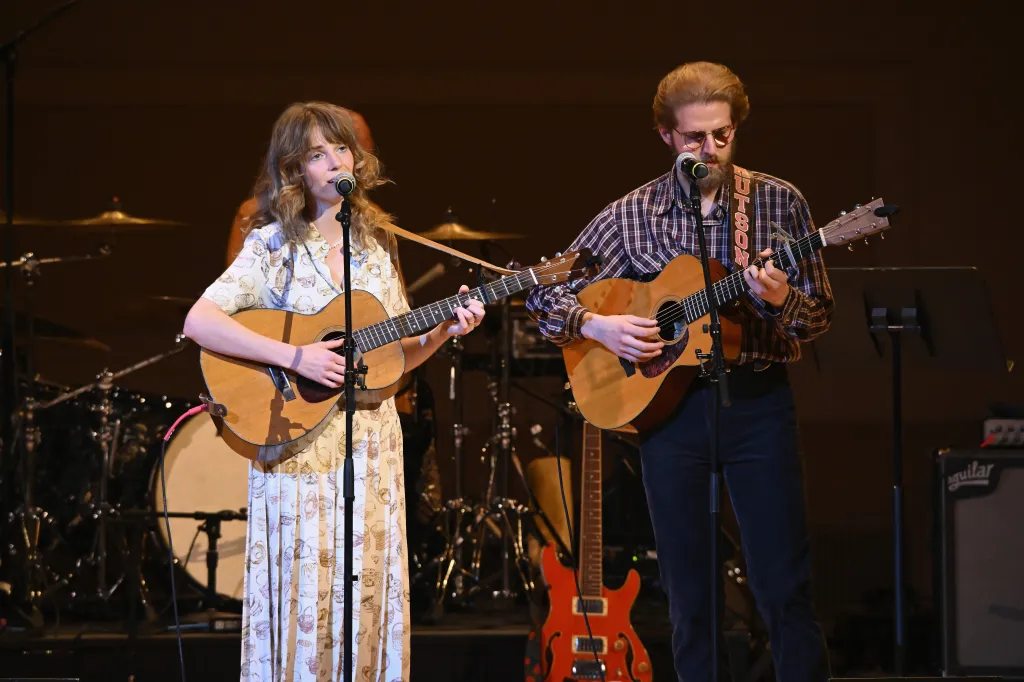 Maya Hawke and Christian Lee Hutson performing onstage at the 37th Annual Tibet House US Benefit Concert.