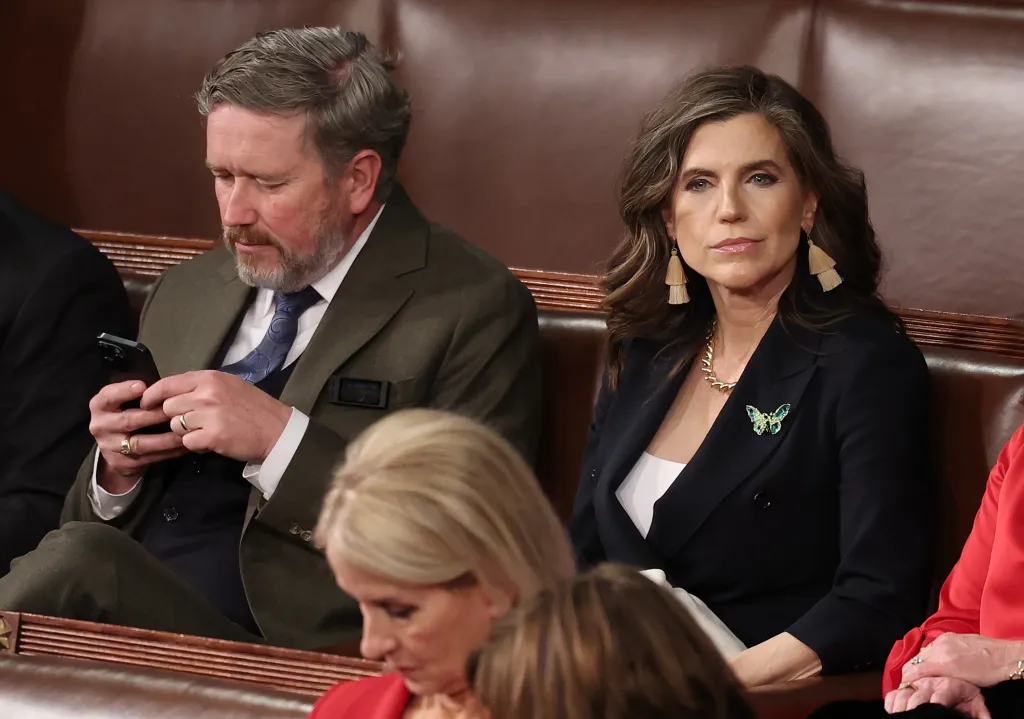 Reps. Thomas Massie and Nancy Mace wait for the start of the State of the Union address.