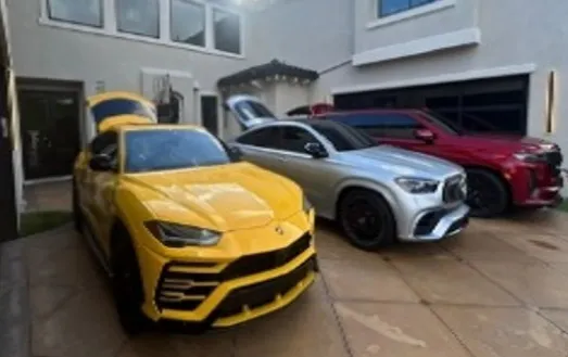 Five luxury cars recovered from a stolen cargo container investigation.