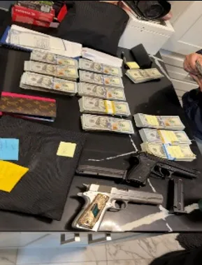 Items and cash recovered during an LAPD investigation of stolen cargo containers.