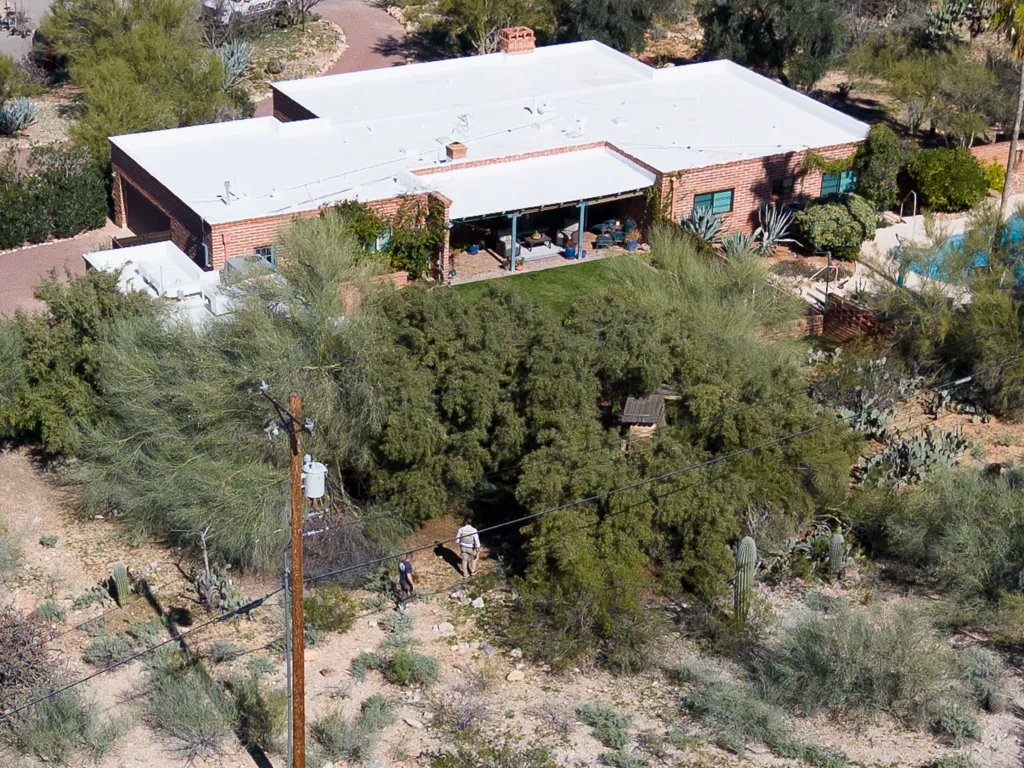 Law enforcement officials search the desert property surrounding the home of Nancy Guthrie in Tucson, Arizona.