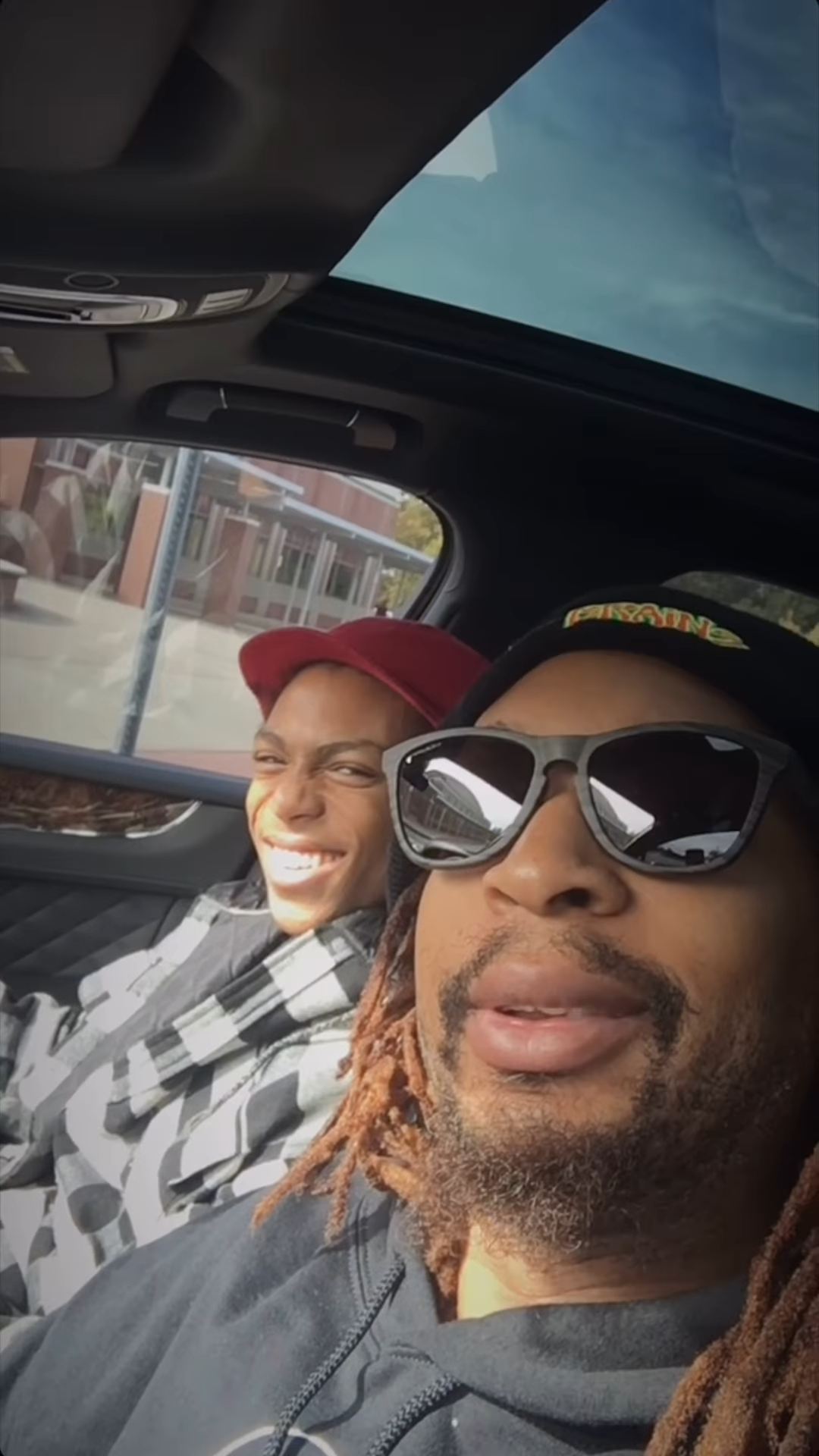 Lil Jon and his son Nathan in a car.