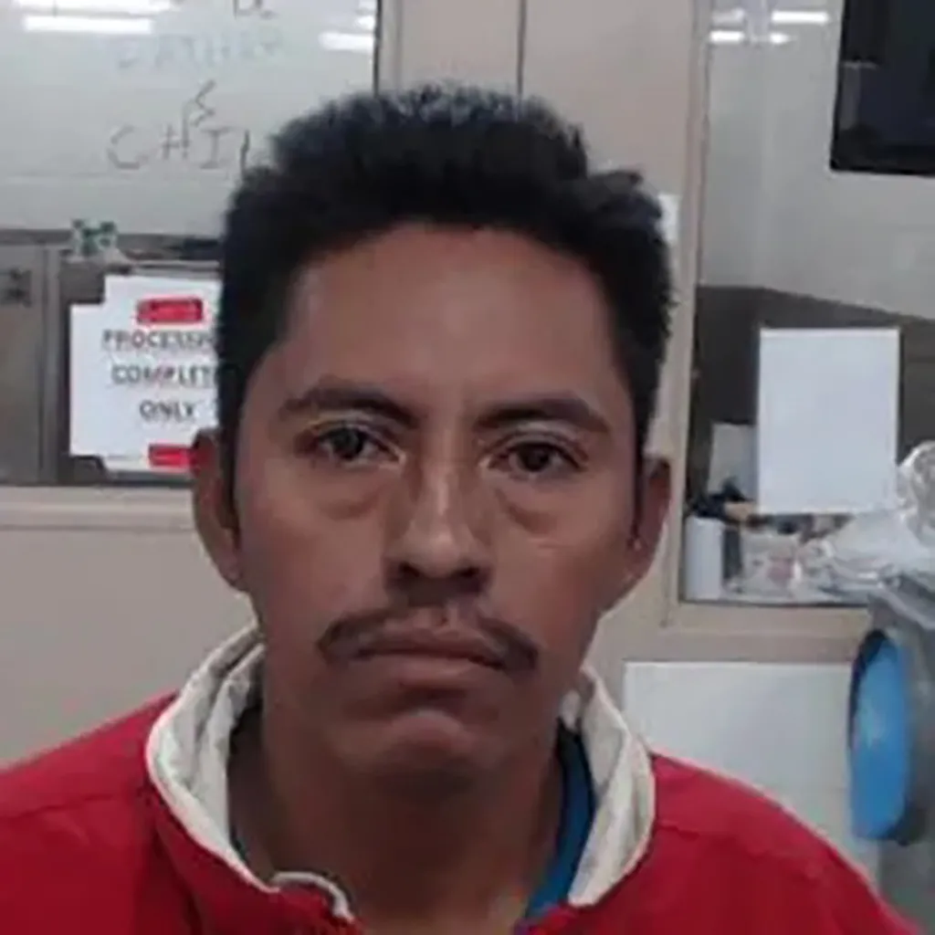 Oscar Vasquez Lopez, an individual with a mustache, looking straight at the camera.