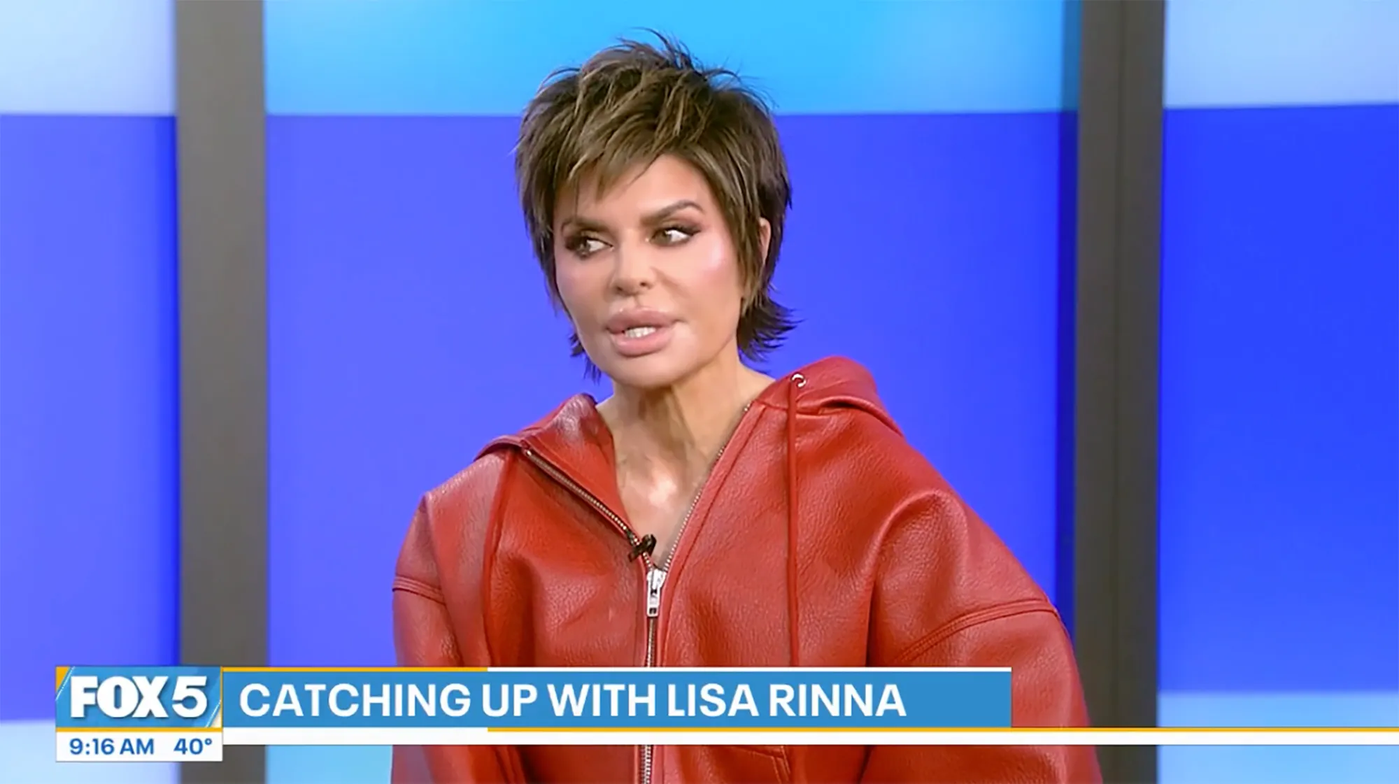 Lisa Rinna wearing a red hoodie on Fox 5.