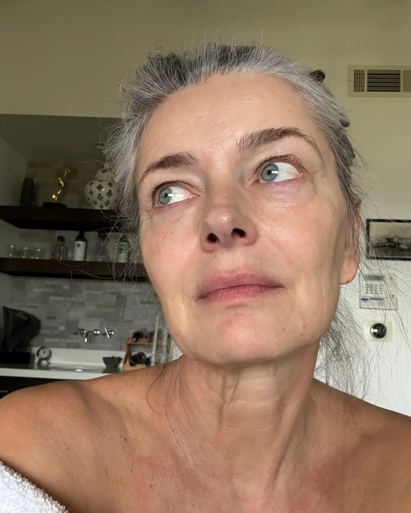 Paulina Porizkova without makeup, showing her wrinkles, graying hair, and natural skin texture.