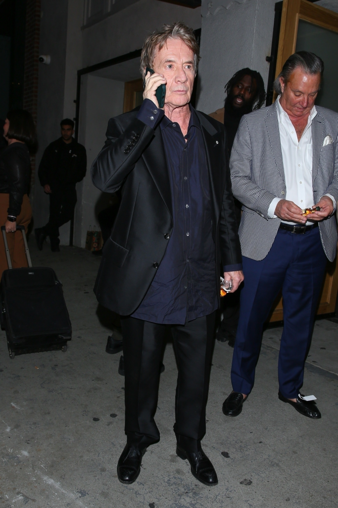 Martin Short on the phone at his daughter's 40th birthday party.