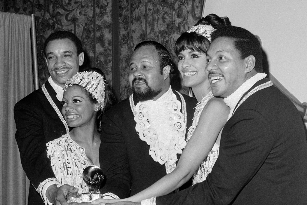 LaMonte McLemore and his Fifth Dimension members Florence LaRue, Ron Townson, Marilyn McCoo, and Billy Davis, Jr., pose with their Grammy Award in Los Angeles on Feb. 29, 1968