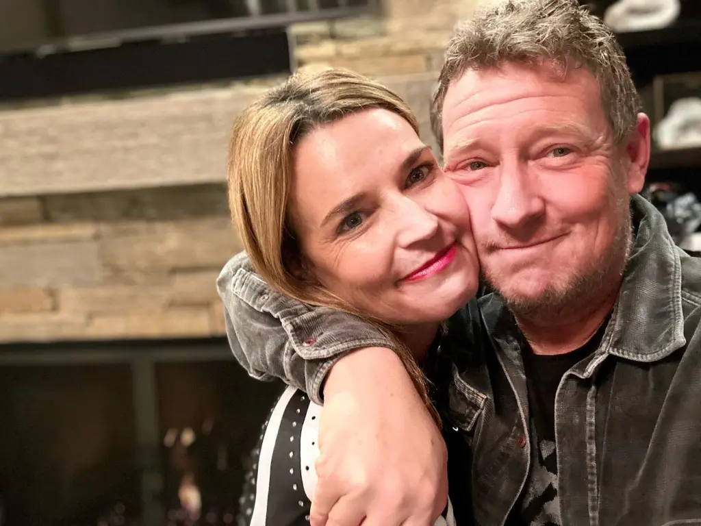 Savannah Guthrie embracing Michael Feldman.