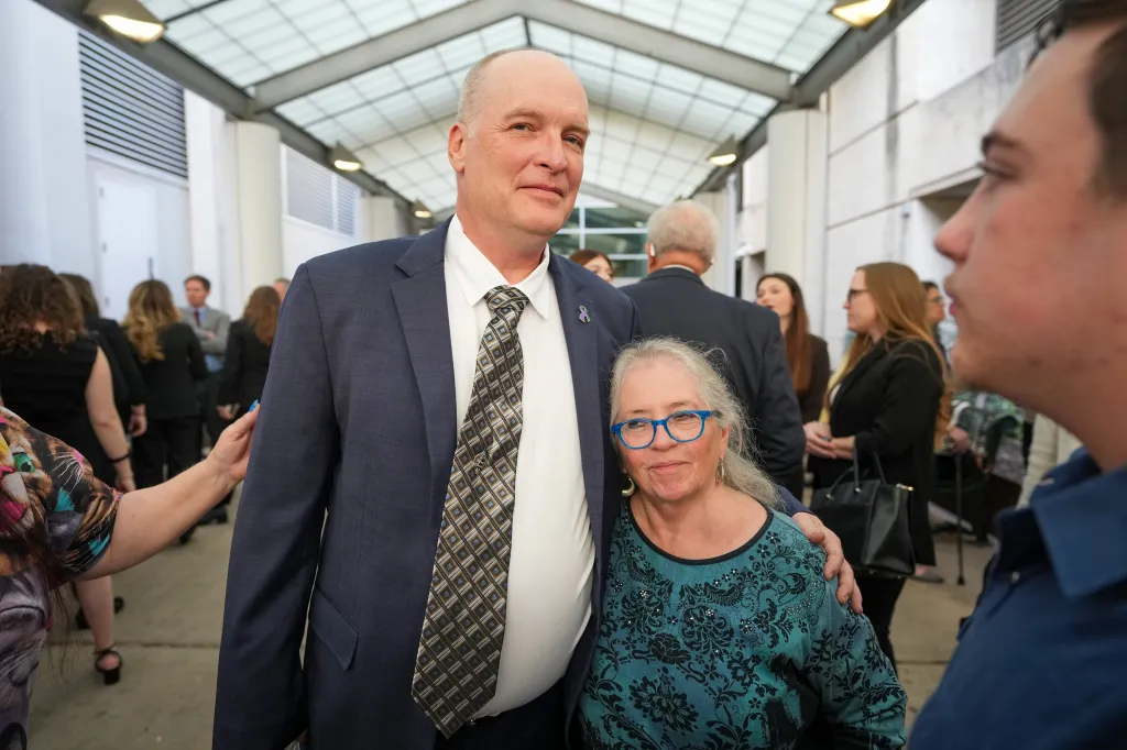Michael Scott with the mother of Forrest Welborn, Sharon Shipman, after his exoneration.