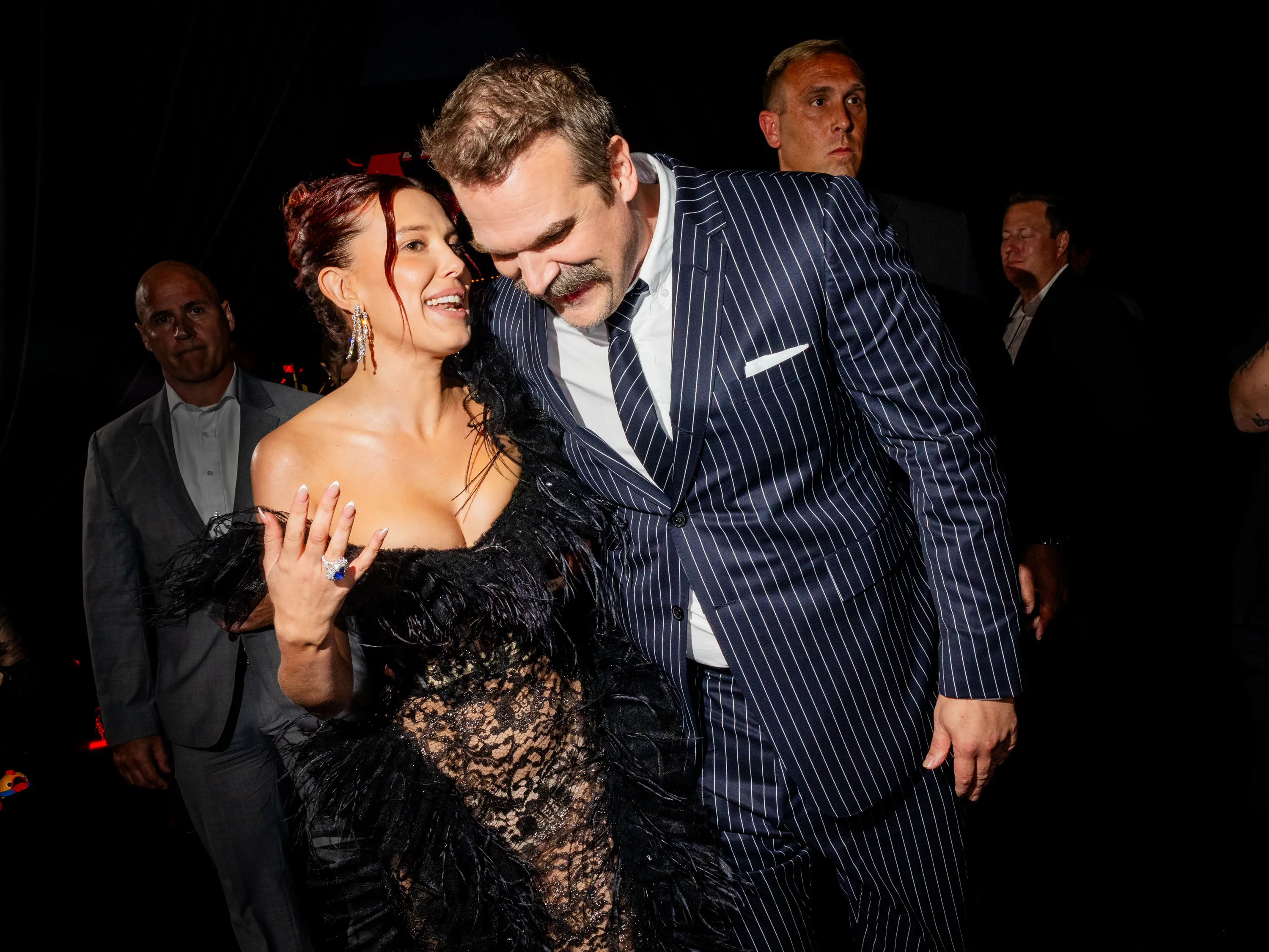 Millie Bobby Brown and David Harbour posing together at the 