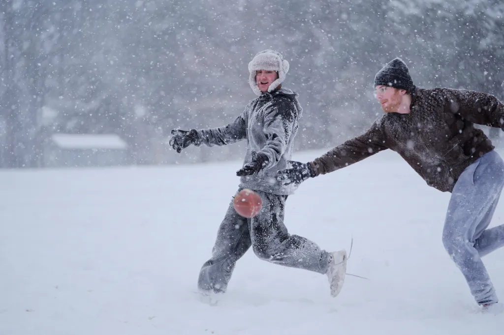 People play in the snow during a storm in Charlotte, North Carolina, on Jan. 31, 2026.