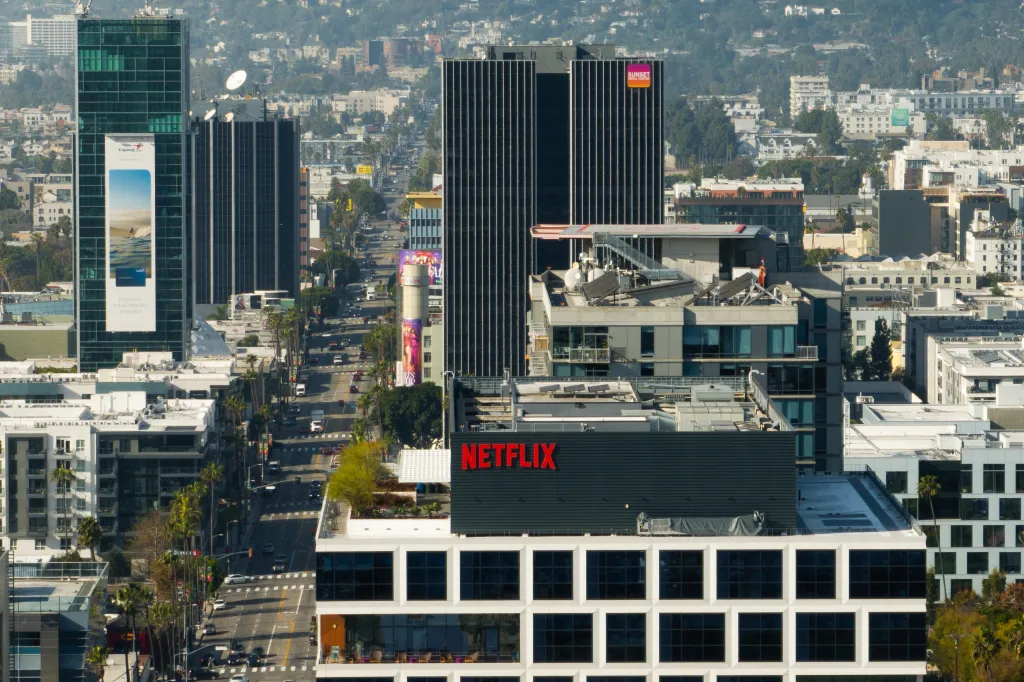 A Netflix sign is displayed atop a building in Los Angeles.