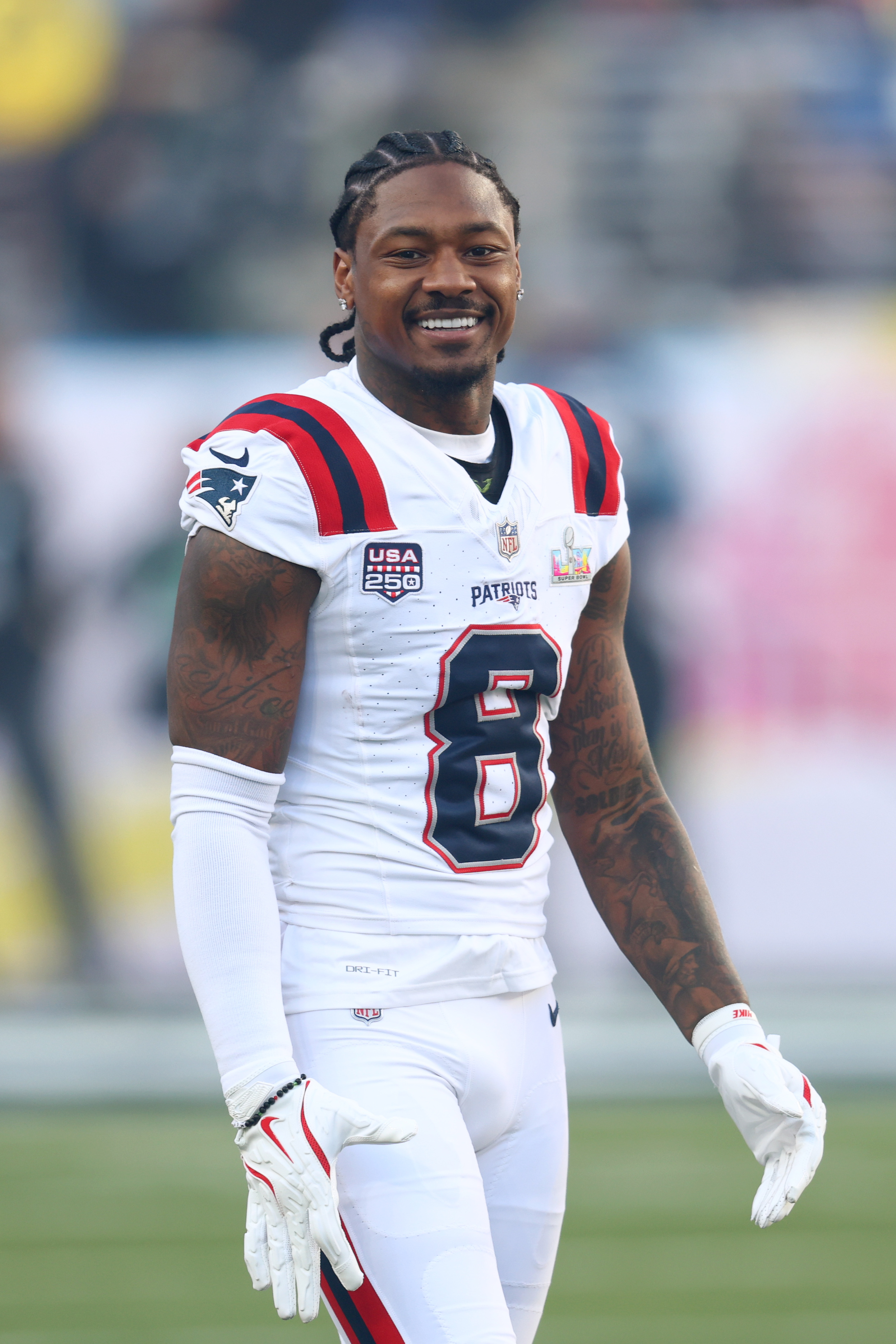 New England Patriots wide receiver Stefon Diggs (8) looks on before Super Bowl LX.