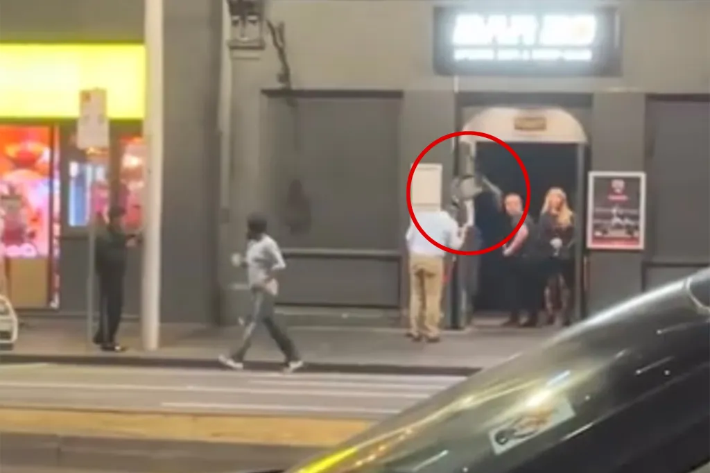 New video has emerged of the moment a man was struck with a flying chair thrown by a (maybe former) friend outside a Melbourne strip club on Friday night.