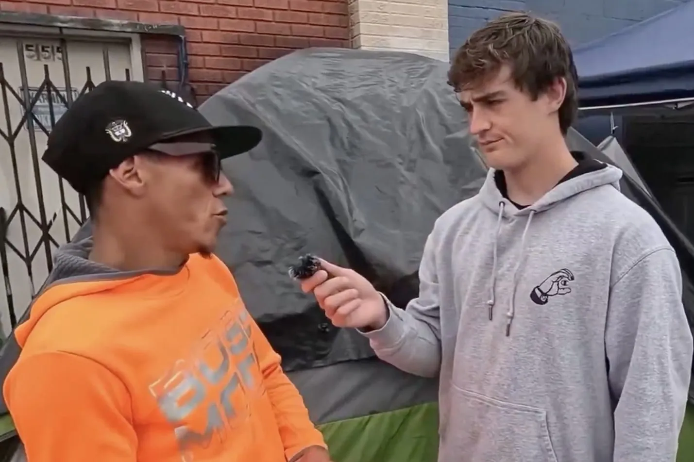 Nick Shirley interviewing a migrant about living conditions in Skid Row.