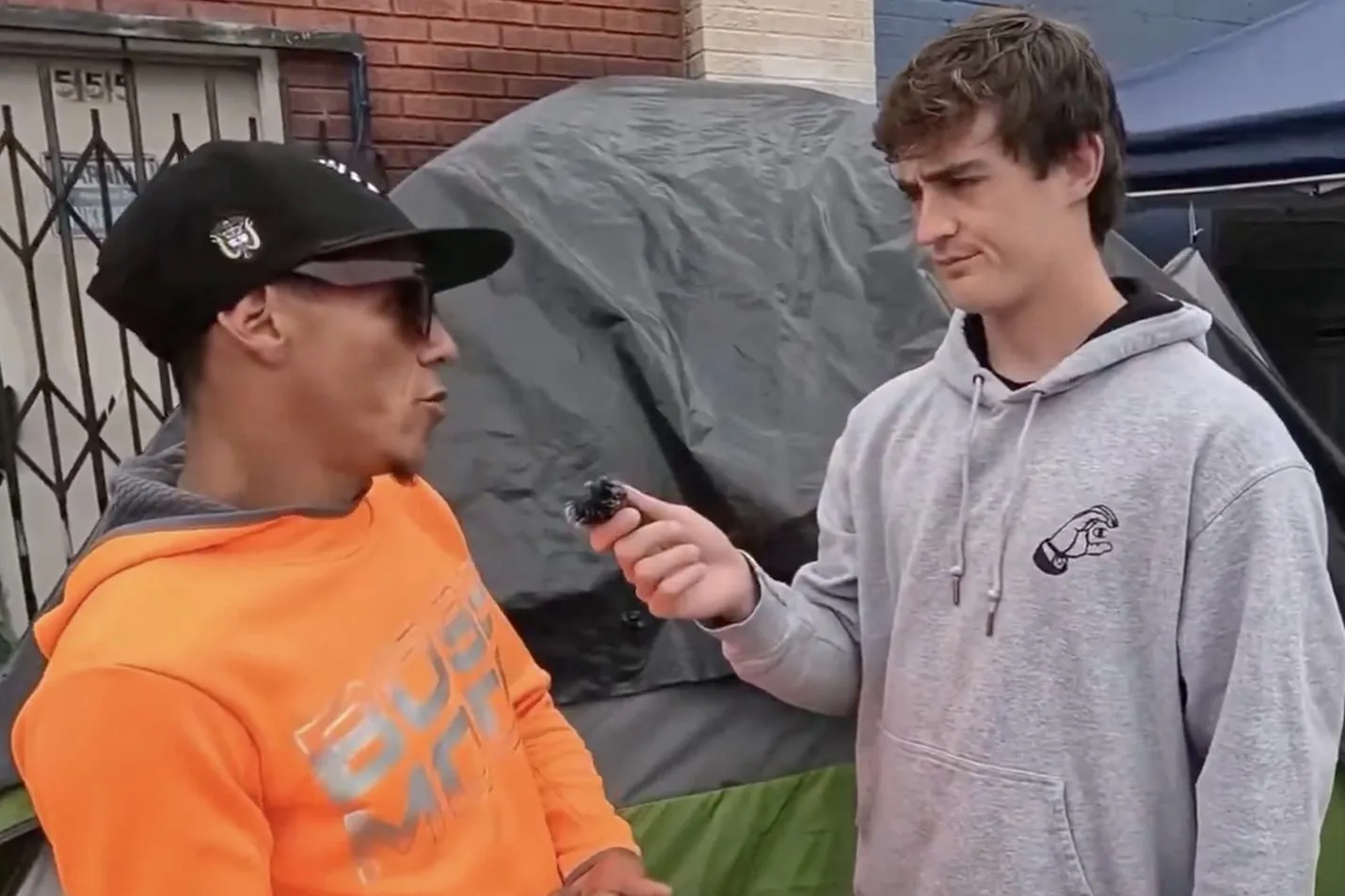 Nick Shirley interviewing a migrant about living conditions in Skid Row.
