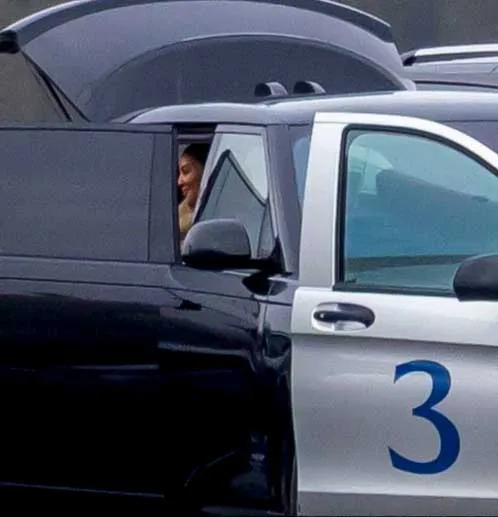 Kim Kardashian in a car at London Oxford Airport.