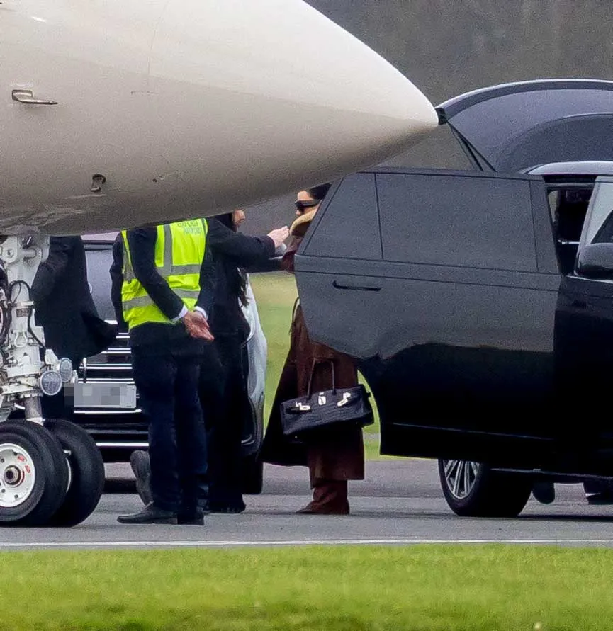 Kim Kardashian departing a private jet and entering a car at London Oxford Airport.