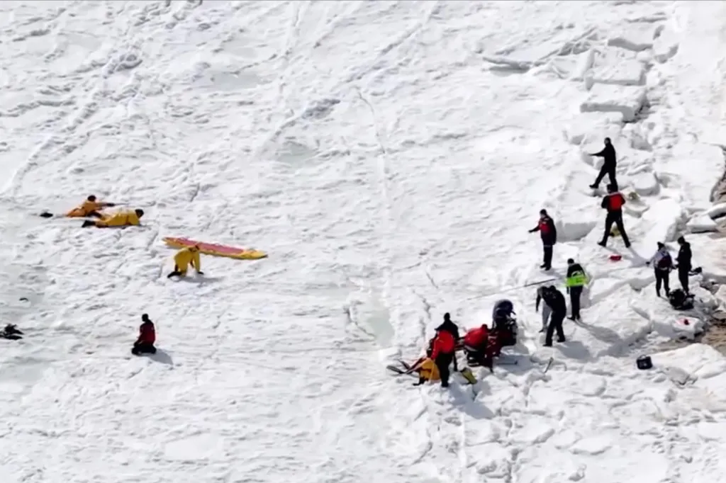 Emergency crews searching a vast expanse of snow and ice.