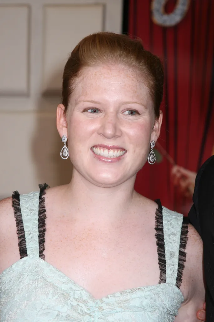 Katherine Short smiling at the opening night of 