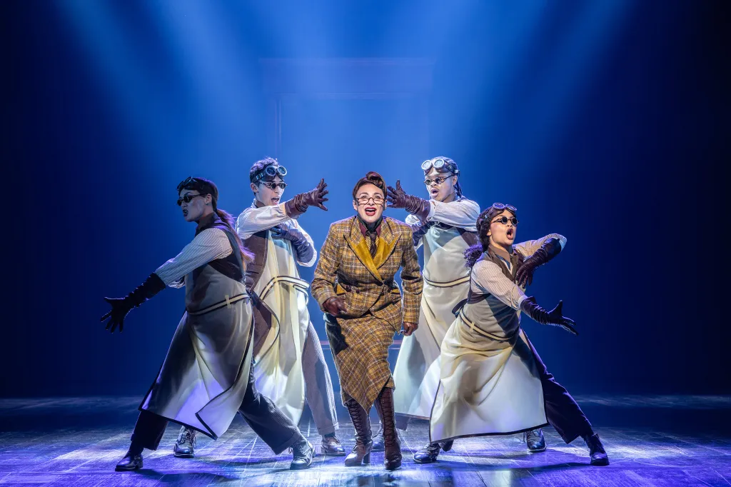 Cast members performing in Paddington The Musical in London.