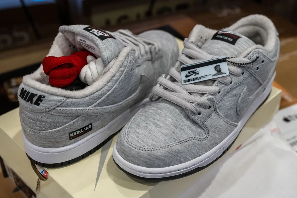 The sneakers appear to be inspired by Kirkland’s signature sweatshirts, which are known for featuring the retailer’s in-house branding in black, gray and white selections.