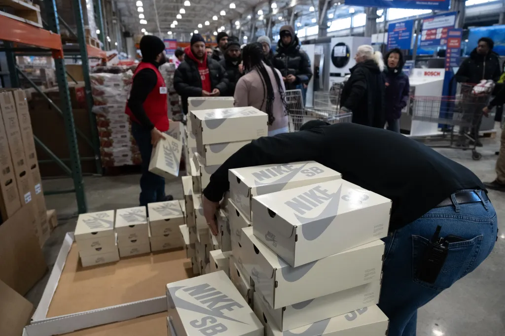 The sneakers, adorned with several Kirkland emblems, come in a gray colorway with an exterior that resembles sweatshirt material and an inner lining that mimics the pilled texture a sweater develops after repeated wear. 