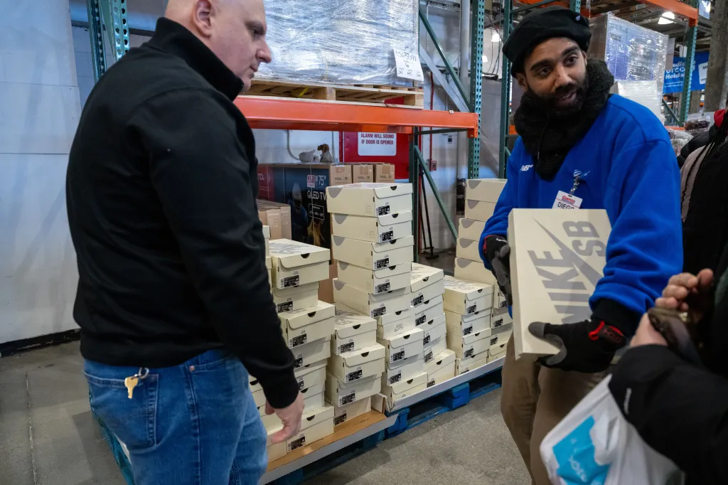 Customers wait on line to purchase a pair of Costco x Nike SB Dunk Low 