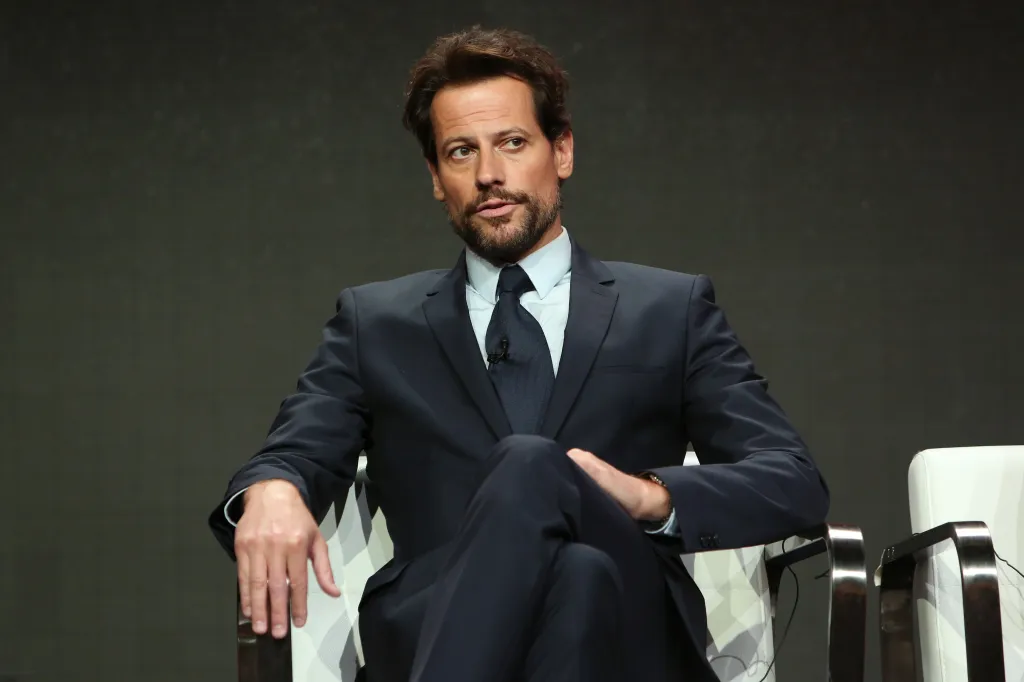 Ioan Gruffudd sitting in a chair, wearing a suit and tie, during the SundanceTV 'Liar' TV show panel at the TCA Summer Press Tour.